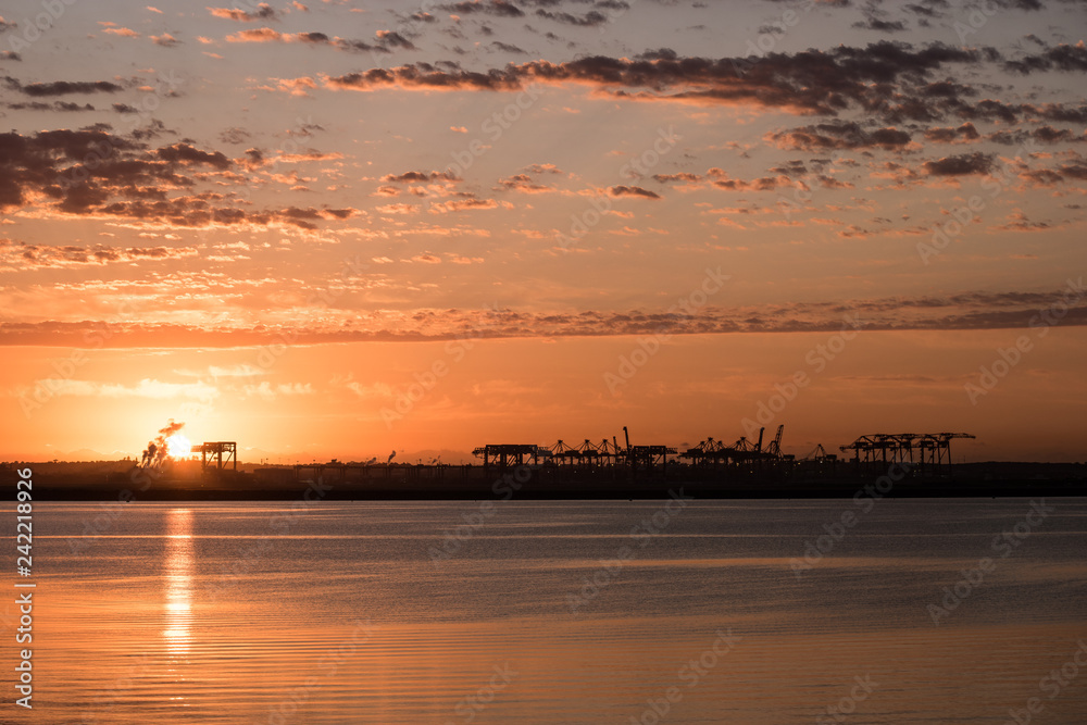 Fototapeta premium sunrise over ocean container terminal