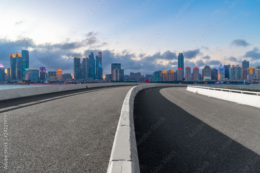 Fototapeta premium Empty asphalt road along modern commercial buildings in China,s cities