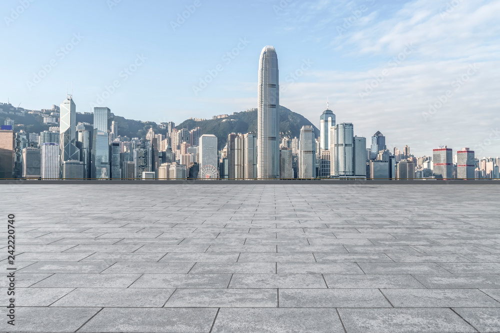Obraz premium Empty marble floors and city views under the blue sky