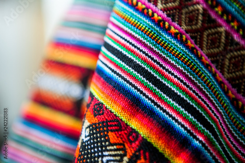 Wooven Wool multicolor andean textile, traditional Fabric Background colourful Texture. Cusco - Perú photo