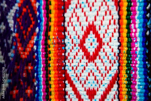 Wooven Wool multicolor andean textile, traditional Fabric Background colourful Texture. Cusco - Perú photo