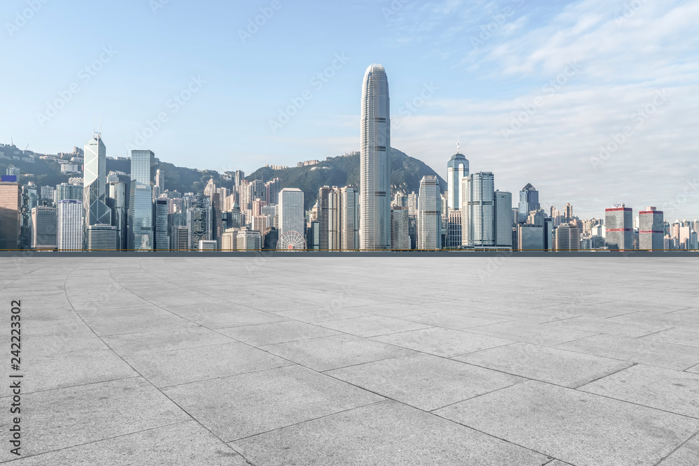 Empty marble floors and city views under the blue sky