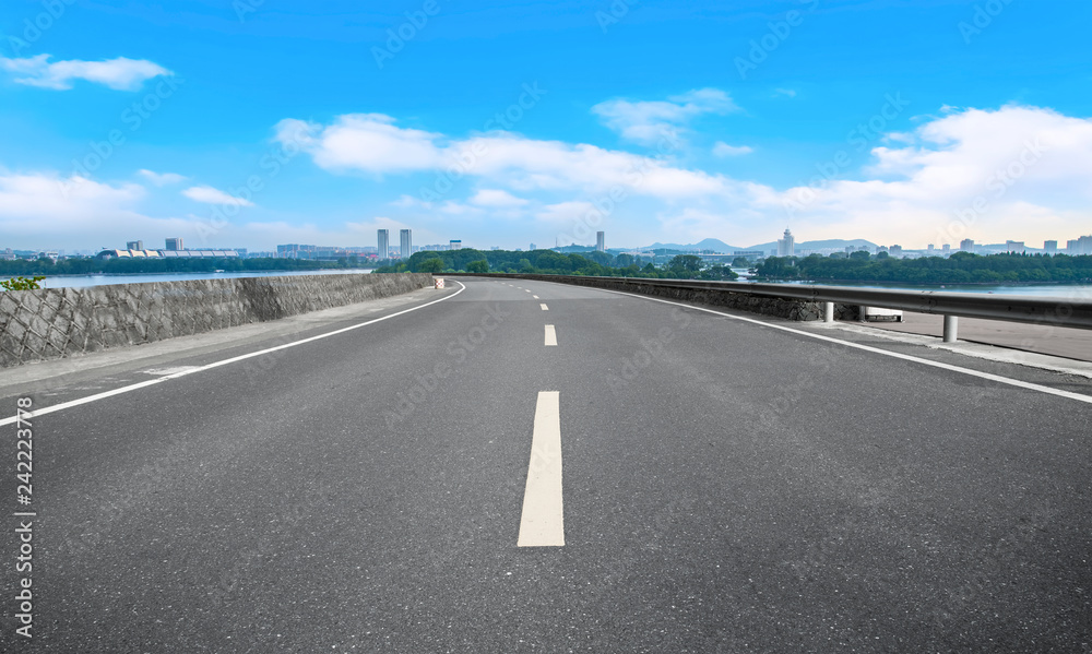 Empty asphalt road square and natural landscape under the blue sky Empty asphalt road square and natural landscape under the blue sky