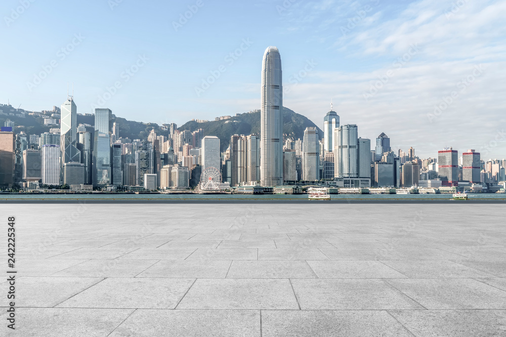 Empty marble floors and city views under the blue sky