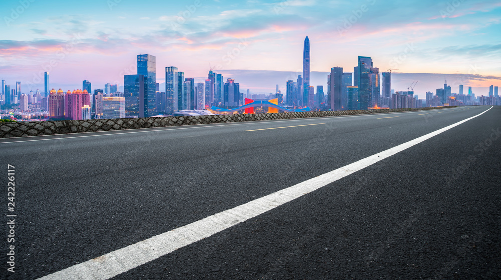 Empty asphalt road along modern commercial buildings in China,s cities