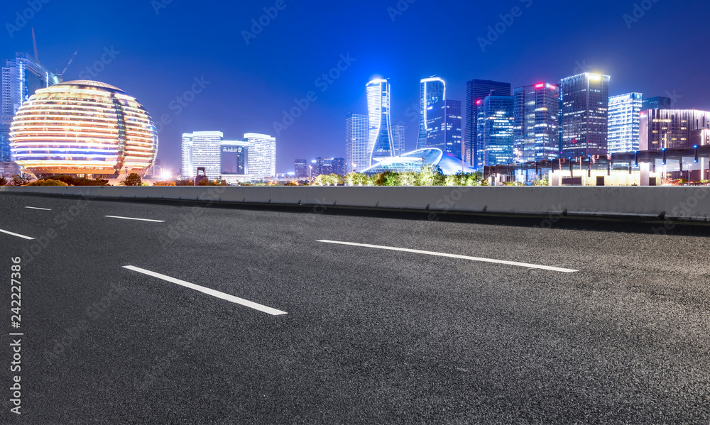 Road Pavement and Night View of Hangzhou Urban Architecture..