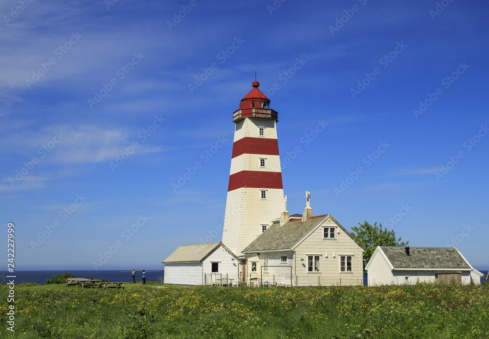 Alnes lighthouse at clear sky at Godoy island near Alesund,