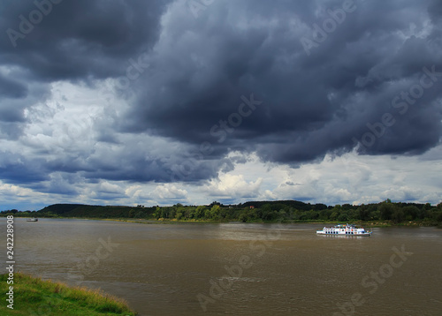 Boat on the lake under the black clouds