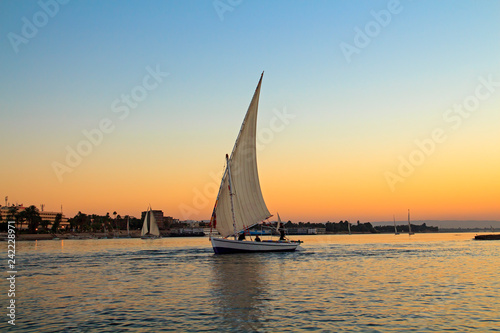 Sailboat at sunset in the Nile, Egypt © ukrolenochka