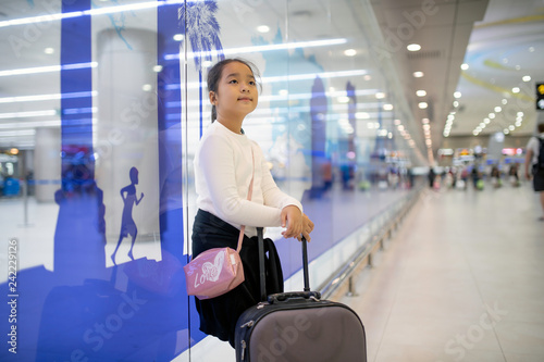 Asian girl and luggage at the airport For traveling by plane.soft focus.
