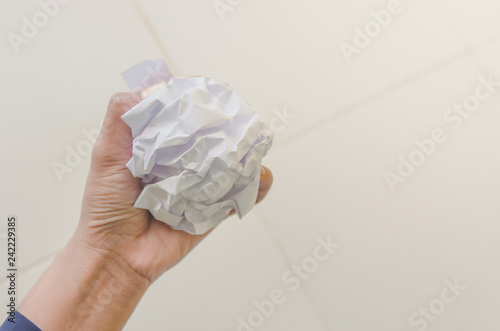 No idea and fail concept - Human hand holding crumpled paper and trash.