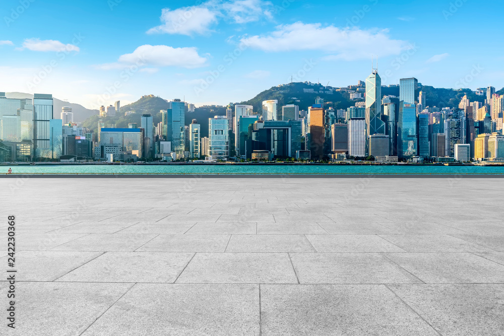 Empty marble floors and city views under the blue sky