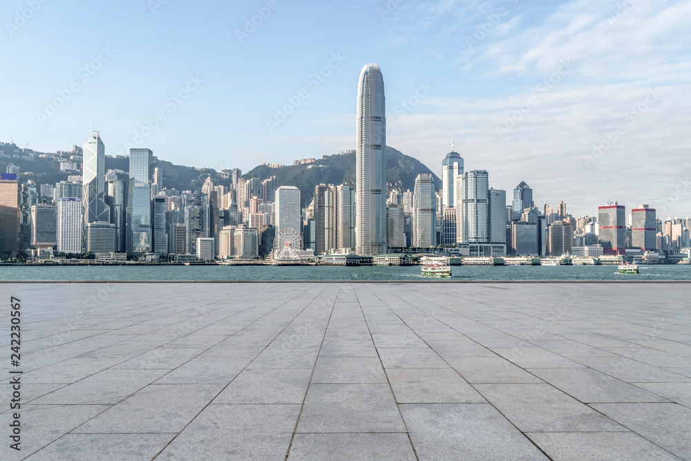 Empty marble floors and city views under the blue sky