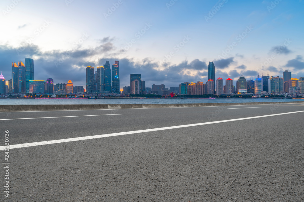 Empty asphalt road along modern commercial buildings in China,s cities