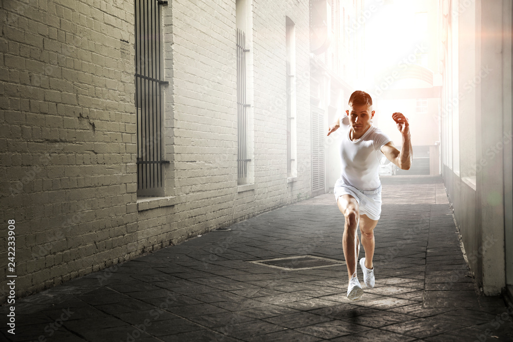 Athlete man running race. Mixed media Athlete man running race. Mixed media