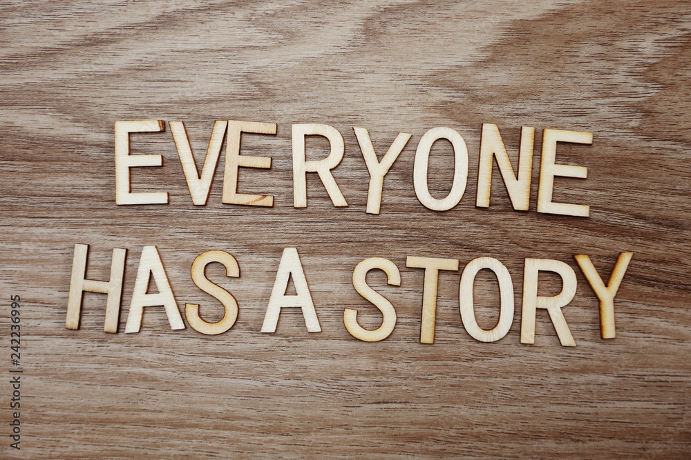 Fototapeta premium every on has a story text message on wooden background