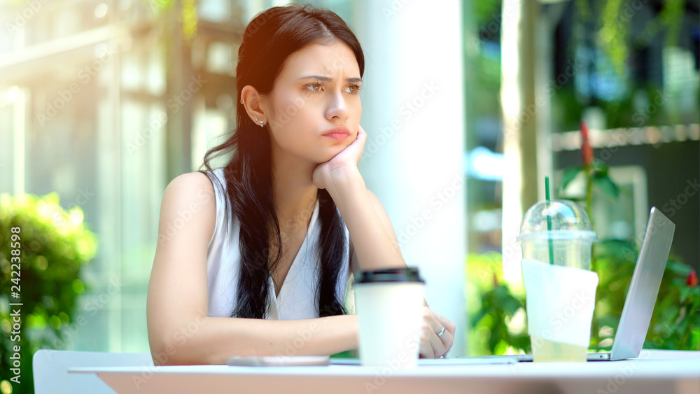 The young woman sitting with feeling stressed and frustrated The young woman sitting with feeling stressed and frustrated