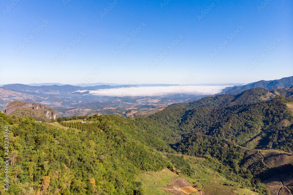 Drone shot aerial view landscape of mountain and nature against blue sky