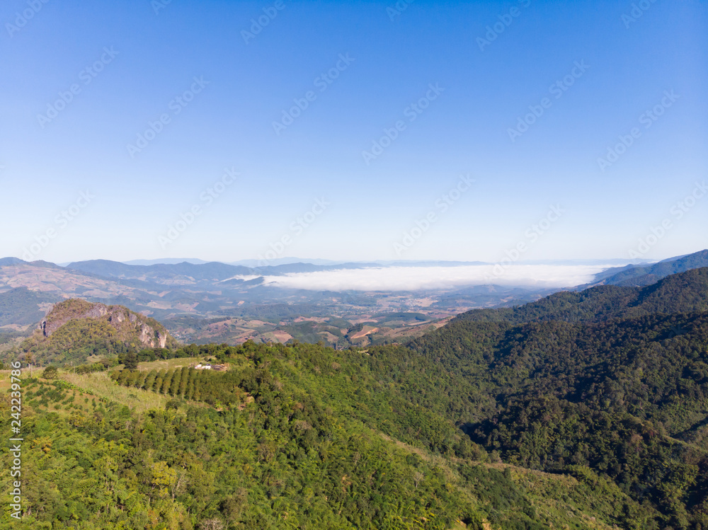 Drone shot aerial view landscape of mountain and nature against blue sky