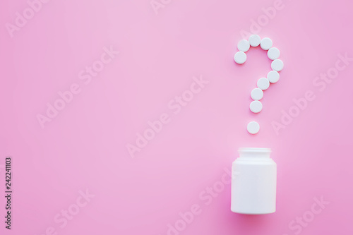 Close up of pills. Dietary supplements. Variety pills. Vitamin capsules on pink background