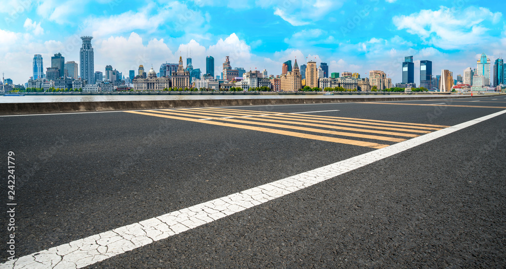 Obraz premium Empty asphalt road along modern commercial buildings in China,s cities
