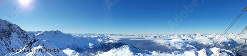 beautiful panoramic view on alpine french peak mountain from ski slope in winter