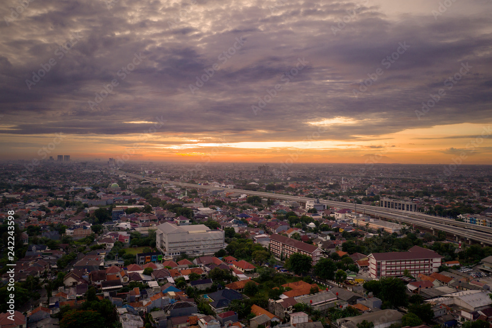 Crowded residential near Becakayu tollway at sunset