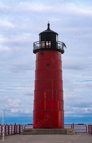 The "Milwaukee Pier Head Lighthouse" as the sun sets and the rain passes.  Milwaukee, Wisconsin, USA