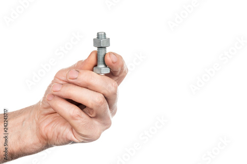 Bolt and nut in male hands