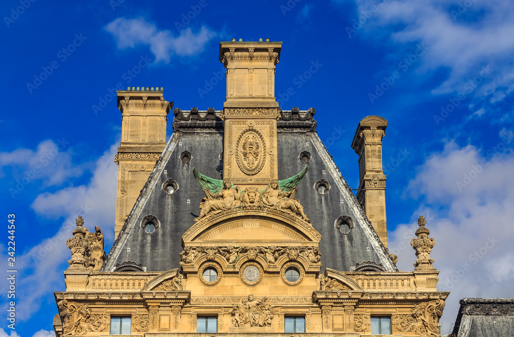 Ornate baroque gable of the roof of the famous Museum of Decorative Arts with ornate ceramics, crystal and fine furniture, from Middle ages to present day in Paris, France