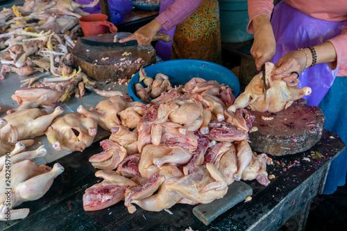chop fresh duck and chicken raw meat at market place