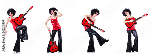 Woman in afro wig playing guitar 