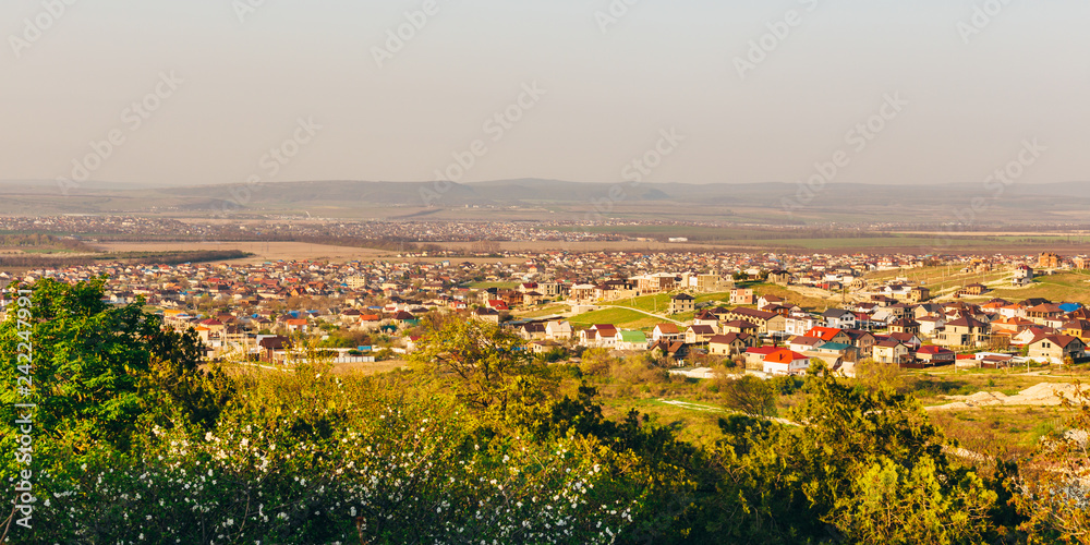 Panoramic view of city neighborhood with blooming trees in springtime. Anapa, Russia
