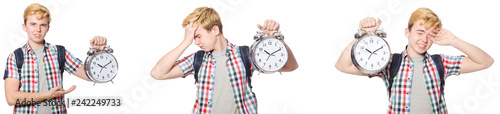 Young boy with alarm-clock in time management concept 