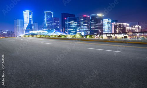 Road Pavement and Night View of Hangzhou Urban Architecture..