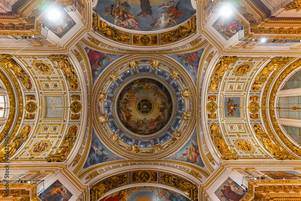 SAINT PETERSBURG, RUSSIA - January 2, 2019: Beautiful interior of the St Isaac's Cathedral. Luxurious ceiling and dome inside the famous cathedral.