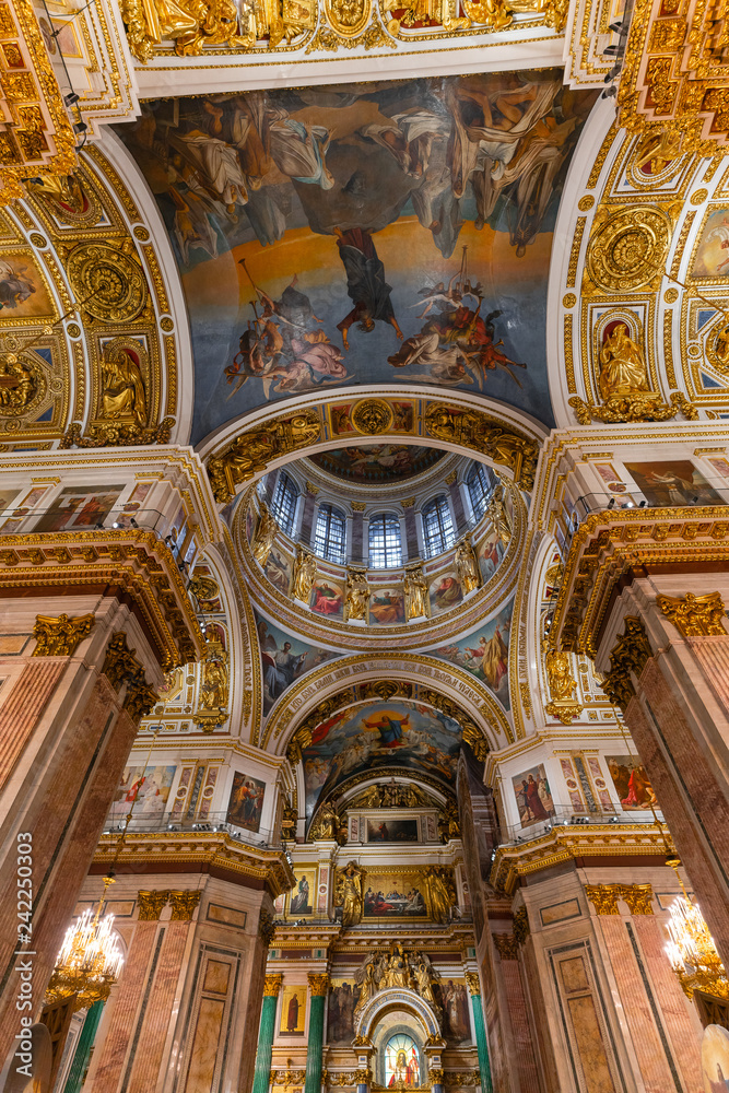 SAINT PETERSBURG, RUSSIA - January 2, 2019: Beautiful interior of the St Isaac's Cathedral. Luxurious ceiling and dome inside the famous cathedral.