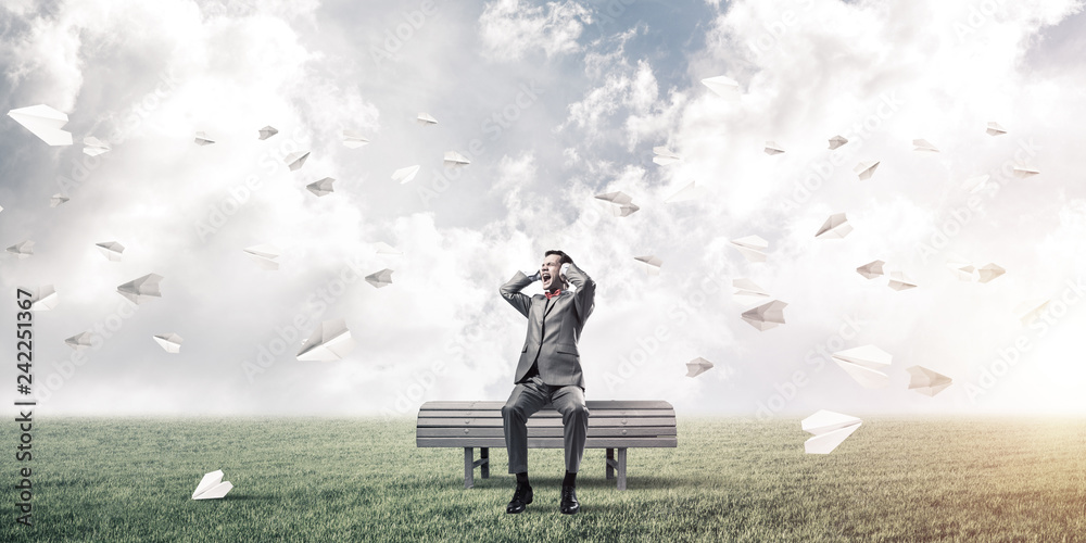 Young man in suit in park dont want to hear anything Young man in suit in park dont want to hear anything