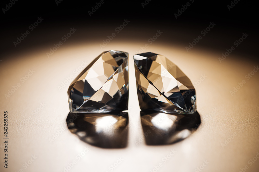 two clear big diamonds on black and golden background two clear big diamonds on black and golden background