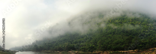 panoramic view of the Salween River twisting along a cloud covered mountain range near Myanmar, Southeast Asia © fieldofvision