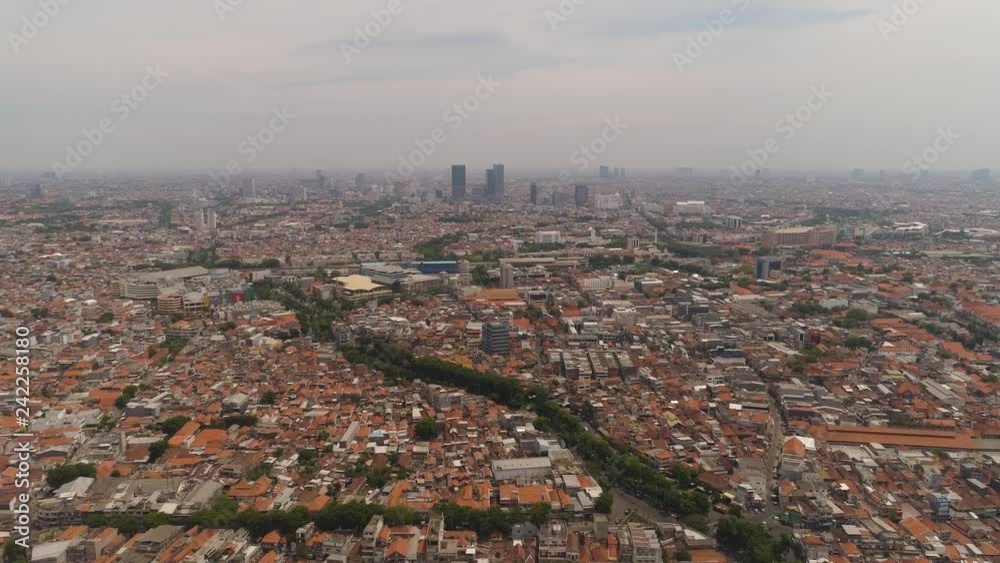 Aerial cityscape modern city Surabaya with skyscrapers, buildings and houses. urban environment in asia city skyline with skyscrapers and business centers java, indonesia Aerial cityscape modern city Surabaya with skyscrapers, buildings and houses. urban environment in asia city skyline with skyscrapers and business centers java, indonesia
