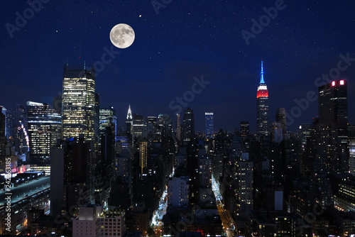 Aerial and panorama view of skyscrapers of New York City, Manhattan. Top view of night midtown of Manhattan with stars and moon.