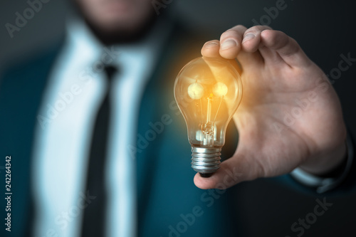 man hand light bulb