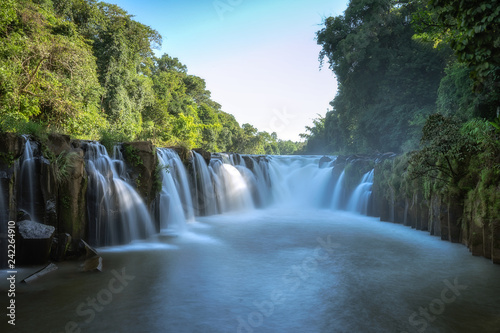 Beautiful large waterfall in the forest. Landscape of rainforest abundant natural resources in Thailand.