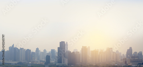 Landscape view of Bangkok city background with rays of sunlight.
