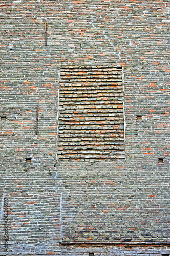 Italy Ravenna, medieval stone and brick wall.