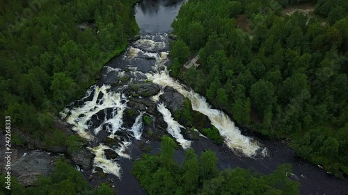 Long shot of unesco waterfall treshold deep in the Russian forests photo