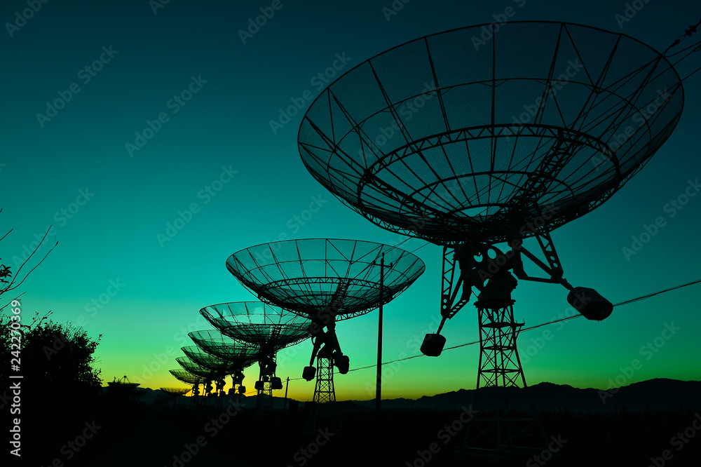 The observatory in the evening,The silhouette of a radio telesco The observatory in the evening,The silhouette of a radio telesco