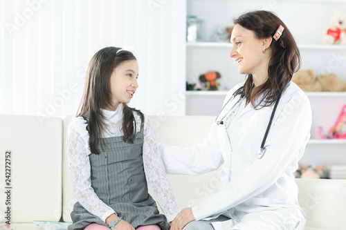 pediatrician, talking positively with a little girl.photo with copy space