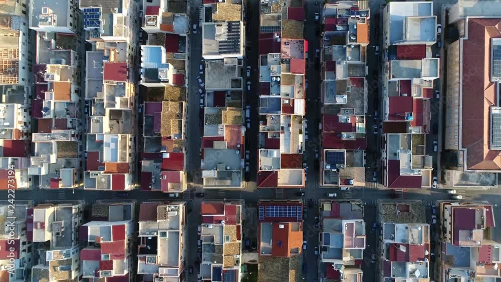 Aerial top down view of building block of Balestrate located in Metropolitan City of Palermo in the Italian region Sicily showing roofs and streets with vehicles driving over 4k high resolution Aerial top down view of building block of Balestrate located in Metropolitan City of Palermo in the Italian region Sicily showing roofs and streets with vehicles driving over 4k high resolution